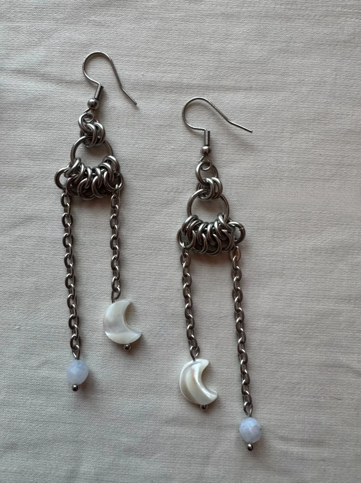 Handcrafted chainmail gemstone earrings with blue lace agate and pearl moon details in stainless steel