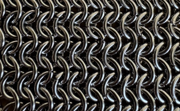 Modern chainmail jewelry including necklace, earrings, bracelet, and crown