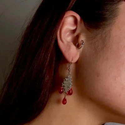 Detail of Crimson fantasy chainmail earrings showing depth and movement