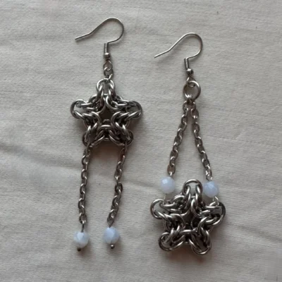 Handcrafted star chainmail earrings made from stainless steel with blue lace agate details