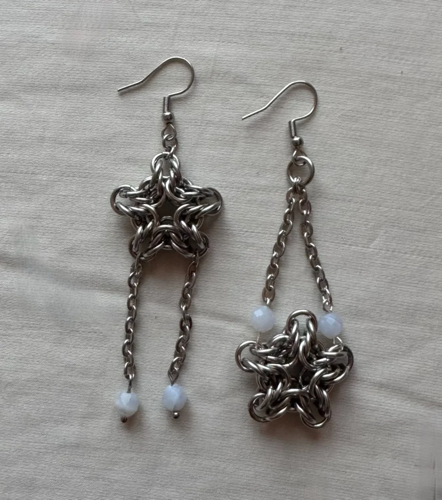 Handcrafted star chainmail earrings made from stainless steel with blue lace agate details