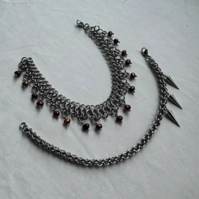 Custom chainmail jewelry set including a necklace, bracelet, and anklet with gemstone accents