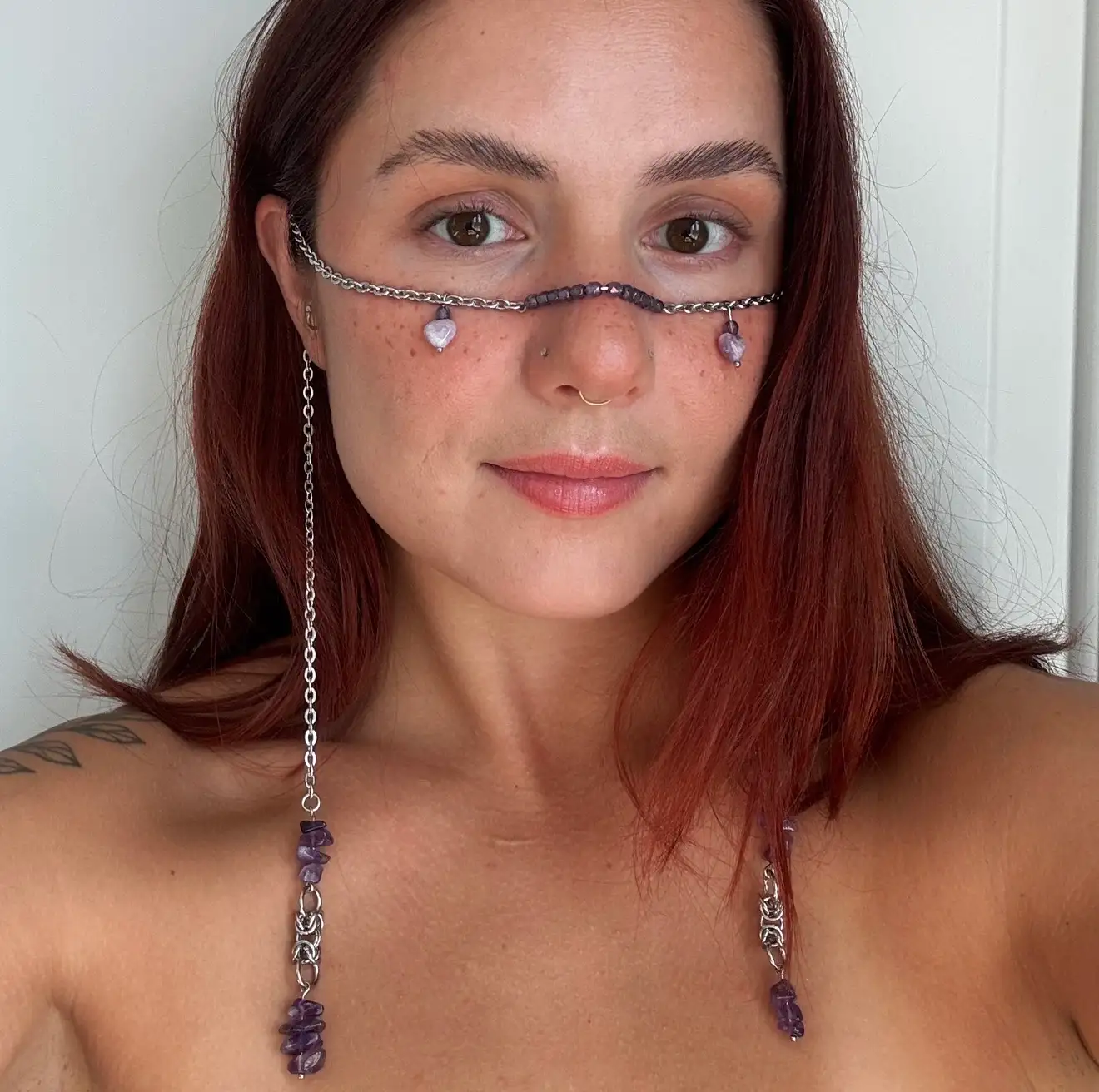 Chainmail face chain with amethyst gemstones worn across the face