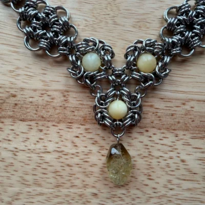 Marigold gemstone chainmail necklace detail with yellow stones and translucent pendant