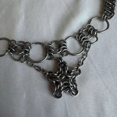 Romy star chainmail necklace detail with woven stainless steel star centerpiece