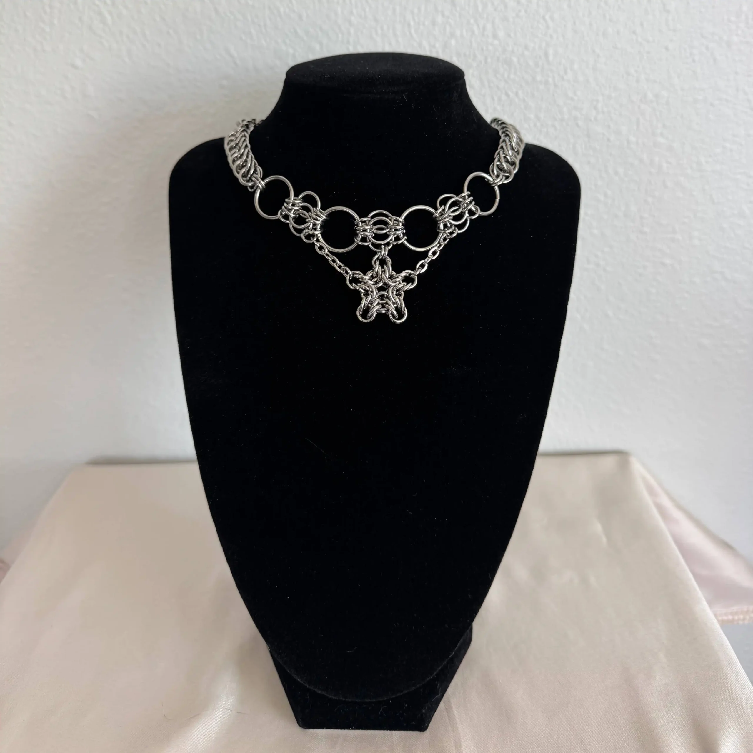 Romy star chainmail necklace with stainless steel woven star centerpiece