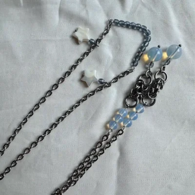 Stainless steel face chain jewelry with white star charms and blue gemstone beads