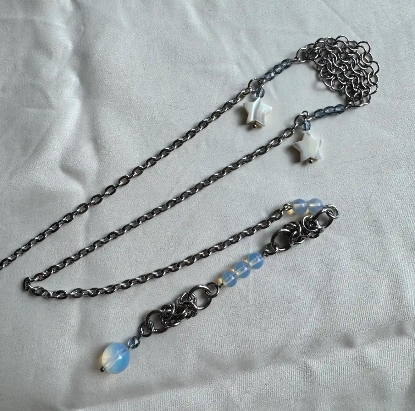 Silver chainmail face chain with white stars and blue opalescent beads